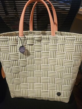 Woven Stripe Tote Bag with Peach Handles. Handmade With 50 Percent Plastic.
